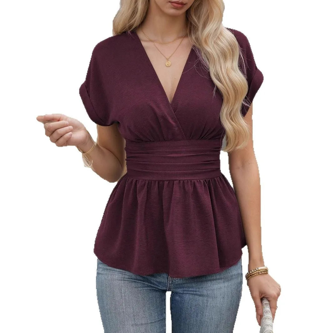 Women's slim fit black V-neck top with pleated waist detail and short sleeves.