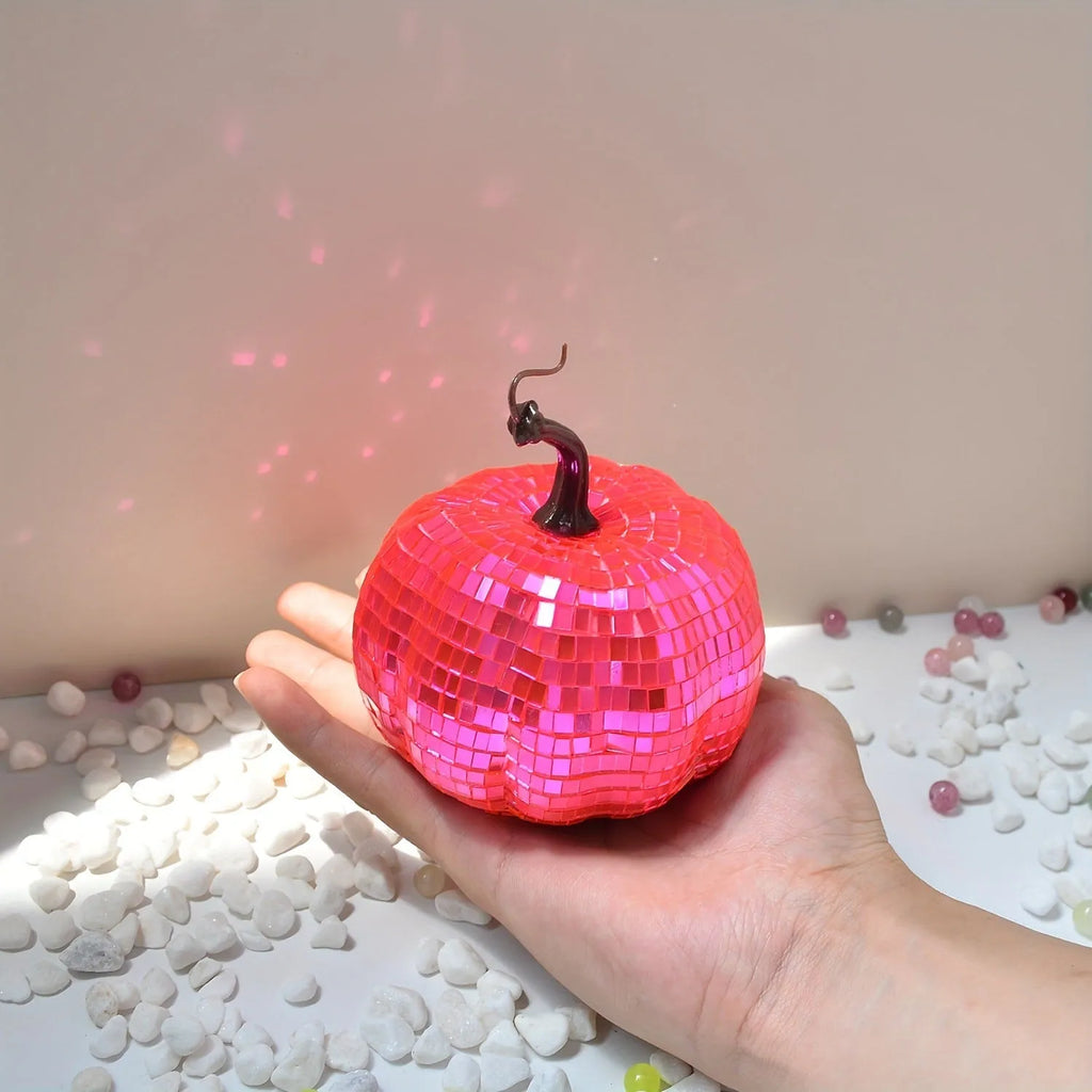 Handcrafted glass pumpkin ornament with embossed detail for Halloween and Christmas decoration.