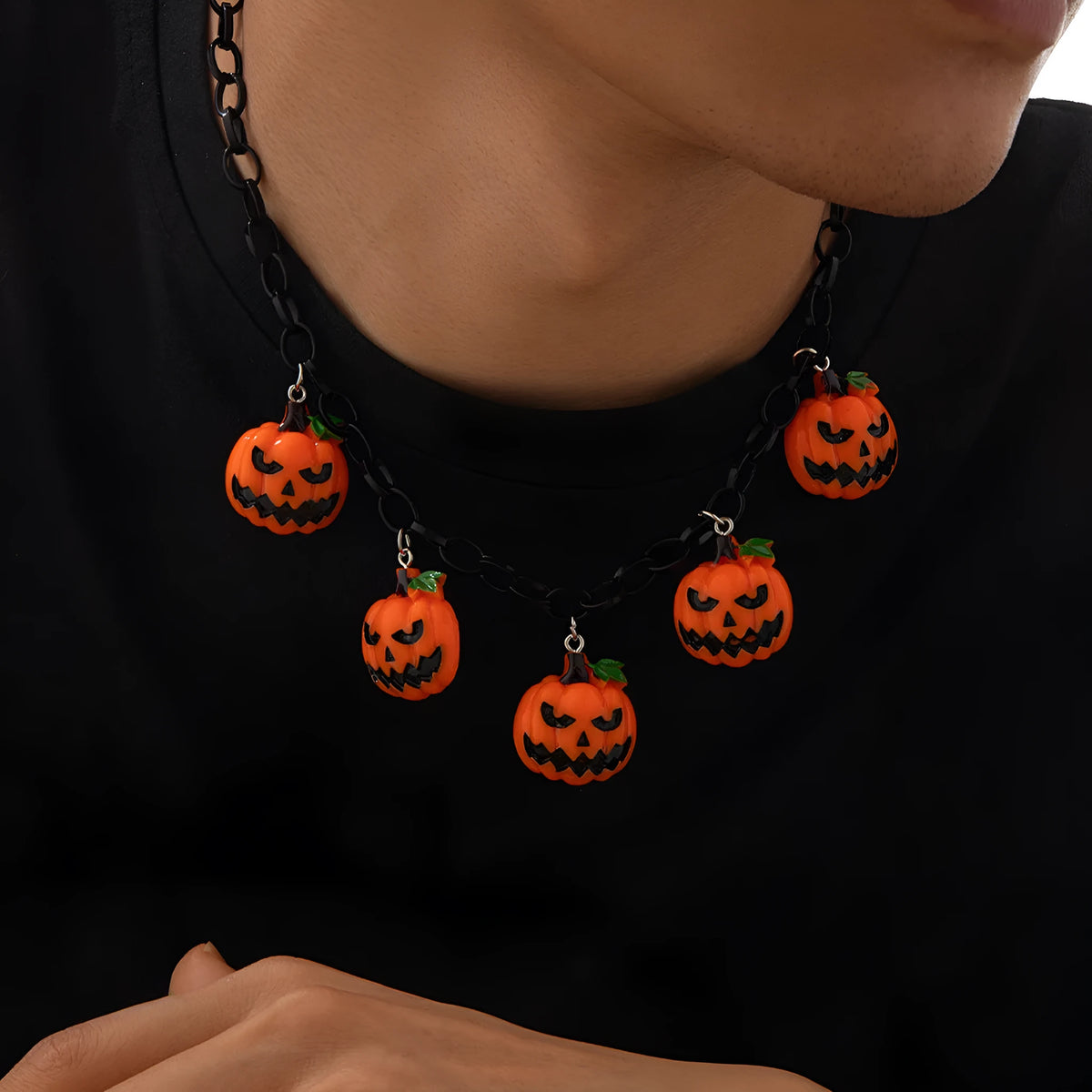 Cartoon pumpkin Halloween necklace with mixed colour acrylic pendant on a regular chain.