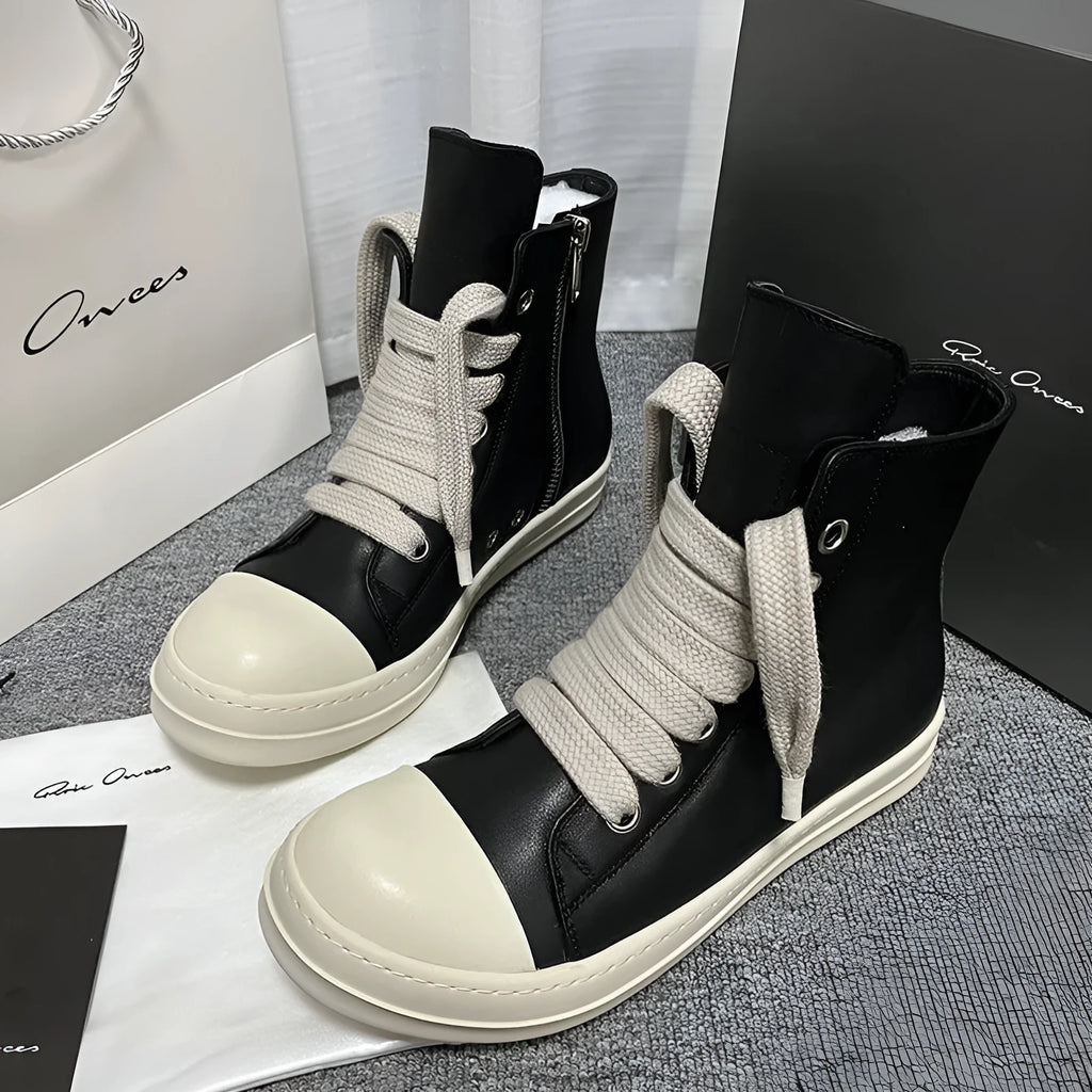 Black genuine leather high-top sneakers with a side zipper and round toe on a rubber platform sole.