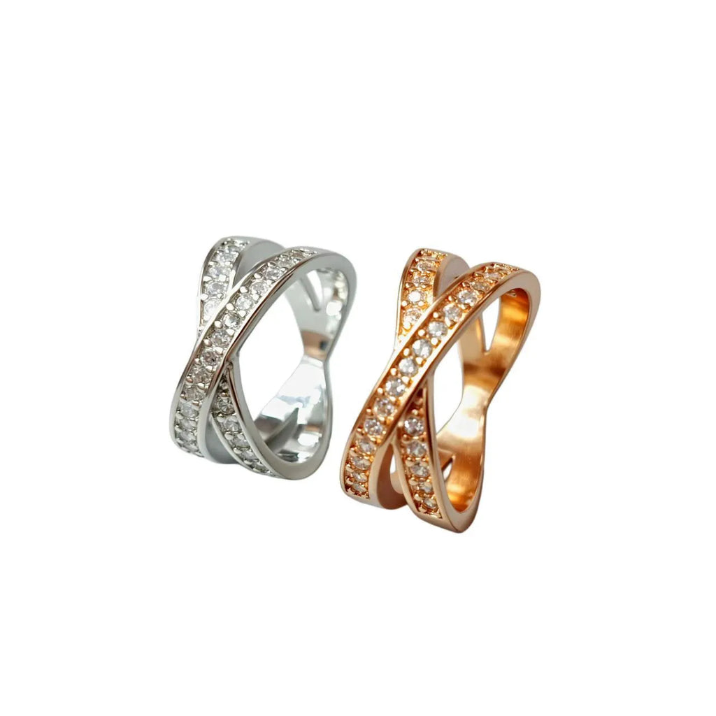 Silver and rose gold metal cross ring with micro-inlaid zircon detailing in heart and geometric design