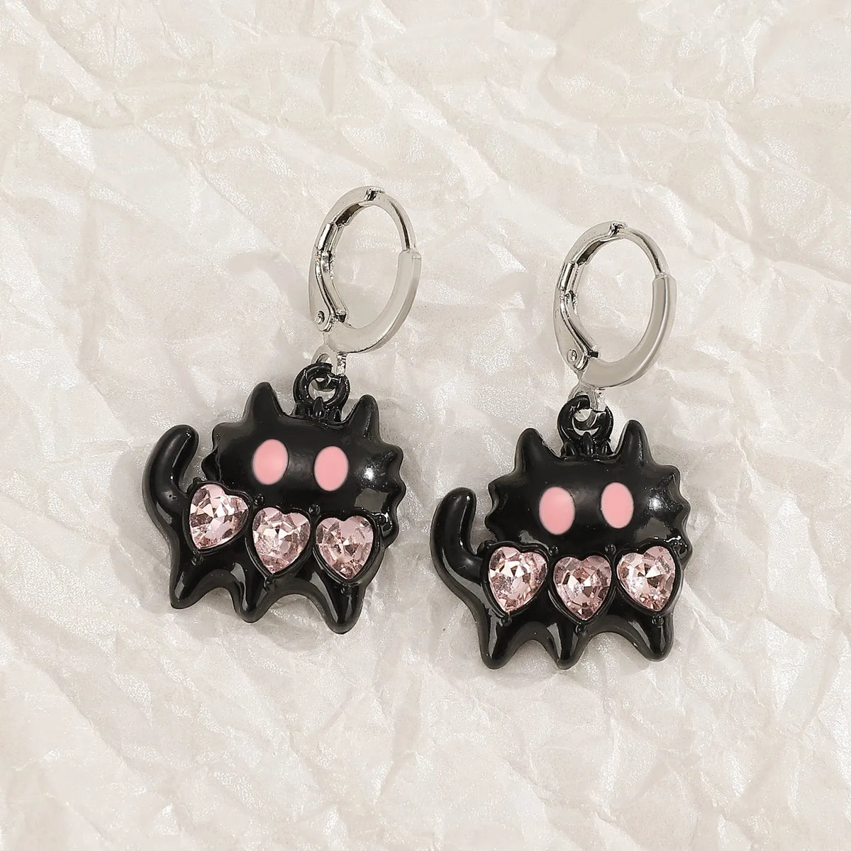 Women's alloy earrings with cross, heart, animal, and zodiac designs in white, black cat, and antique silver finishes
