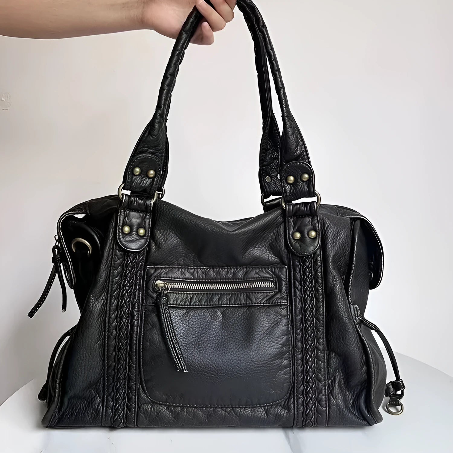 Women's retro motorcycle messenger shoulder bag in brown with woven detail accents and horizontal square shape