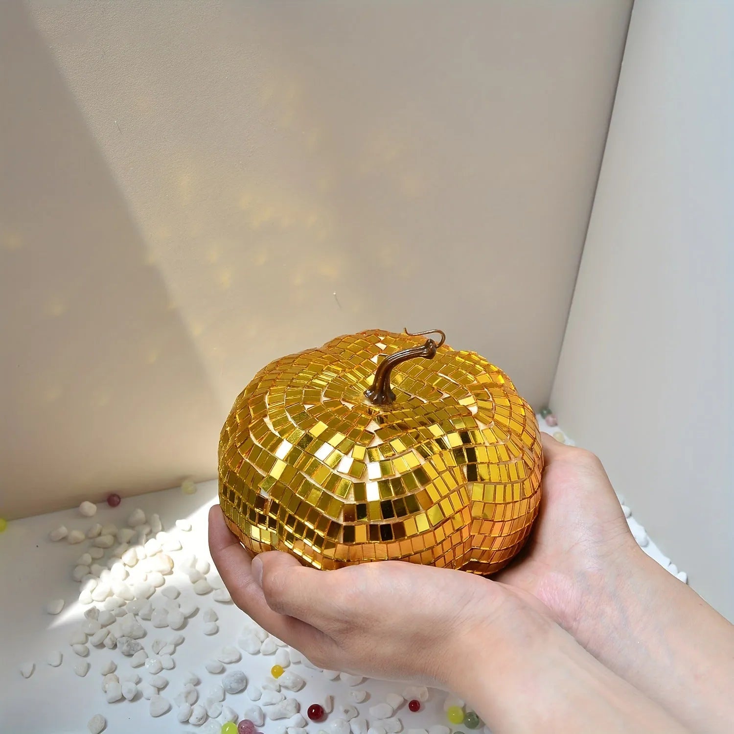 Handcrafted glass pumpkin ornament with embossed detail for Halloween and Christmas decoration.