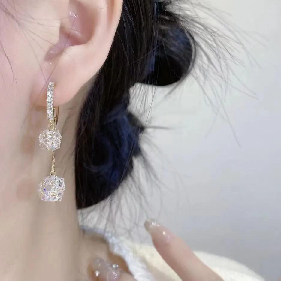 Silver women's earrings with balloon and rhinestone pendants in drop shape design.