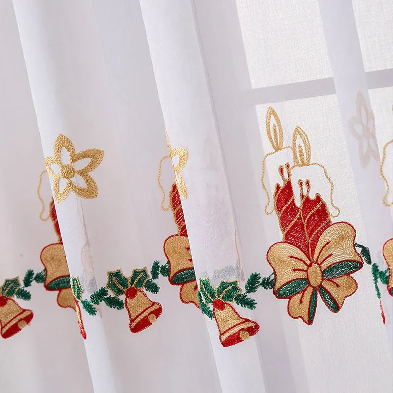 Pair of American Christmas curtains with white embroidered snowflake design on red polyester fabric, hung on a window.