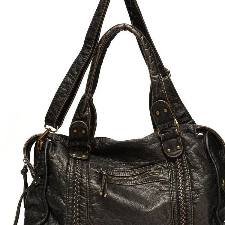 Women's retro motorcycle messenger shoulder bag in brown with woven detail accents and horizontal square shape