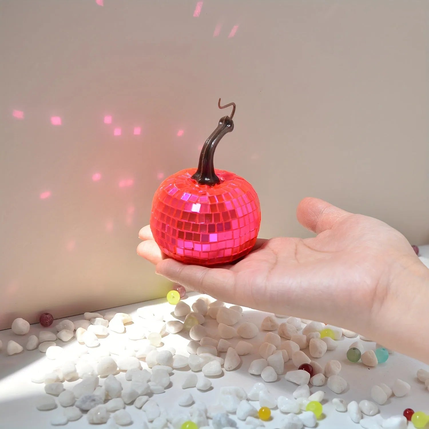 Handcrafted glass pumpkin ornament with embossed detail for Halloween and Christmas decoration.