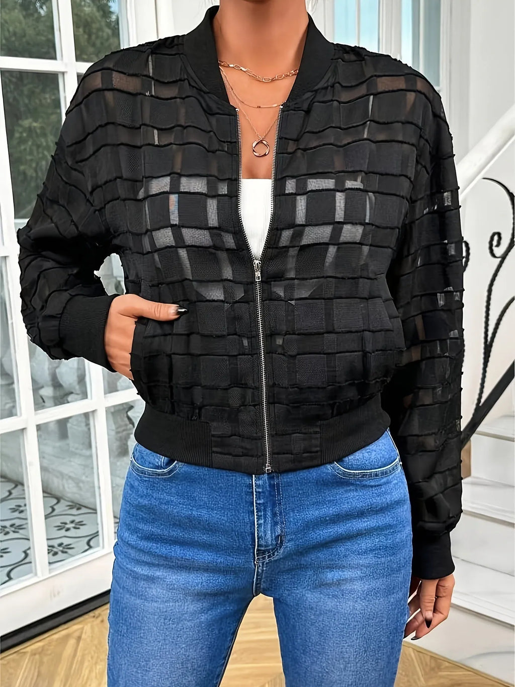 Black women's casual zip jacket with a semi-transparent geometric pattern.