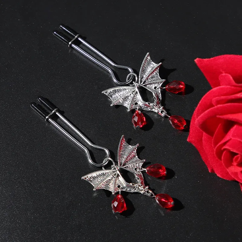Silver bat nipple clamp with adjustable ruby clip for clitoral stimulation