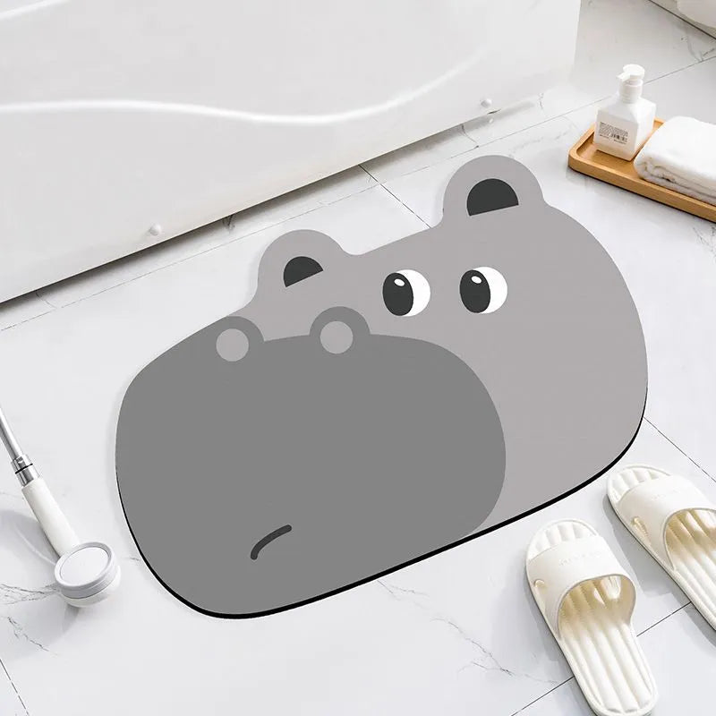 Cartoon animal diatomaceous earth bathroom mat in alien shape on a bathroom floor.