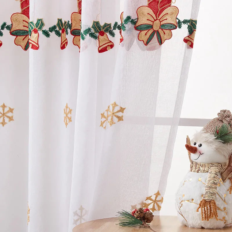 Pair of American Christmas curtains with white embroidered snowflake design on red polyester fabric, hung on a window.