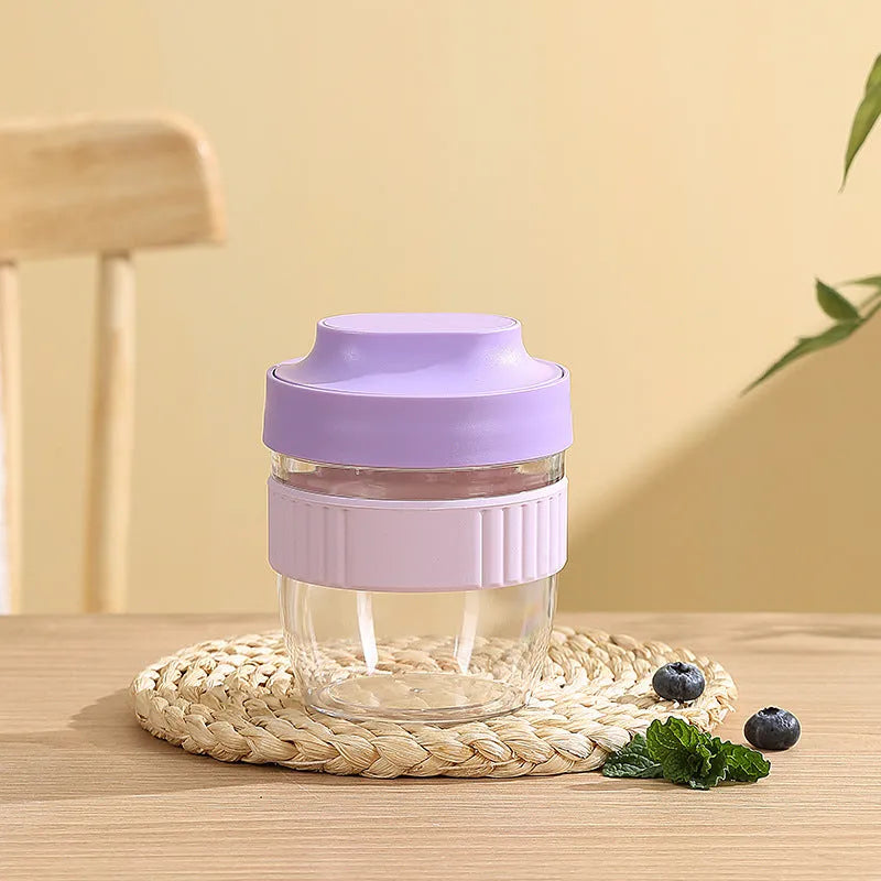 Green, purple, white, and pink plastic salad cups with lids and spoons in small and large sizes.