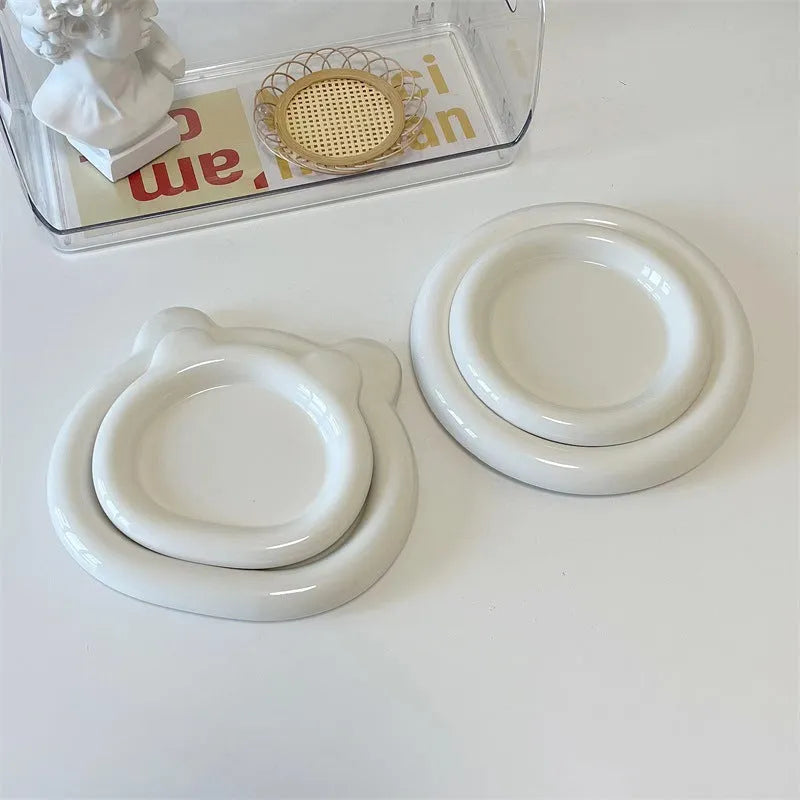 White ceramic plate with chubby toot bear illustration, porcelain potted tray.