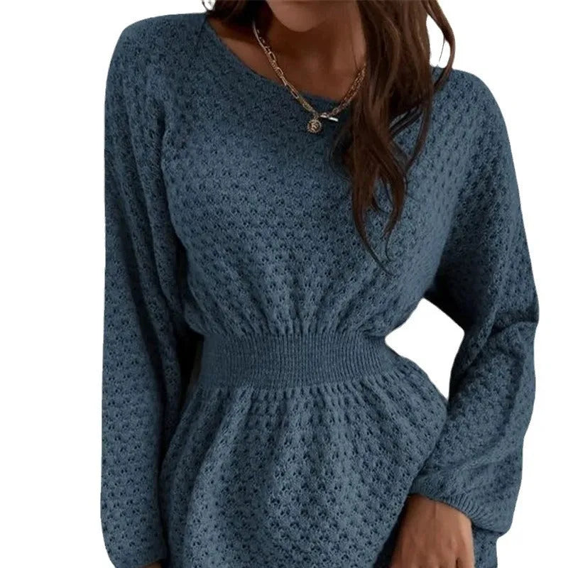 Blue women's knitted dress with crocheted flowers, a round neck, and a fitted waist.