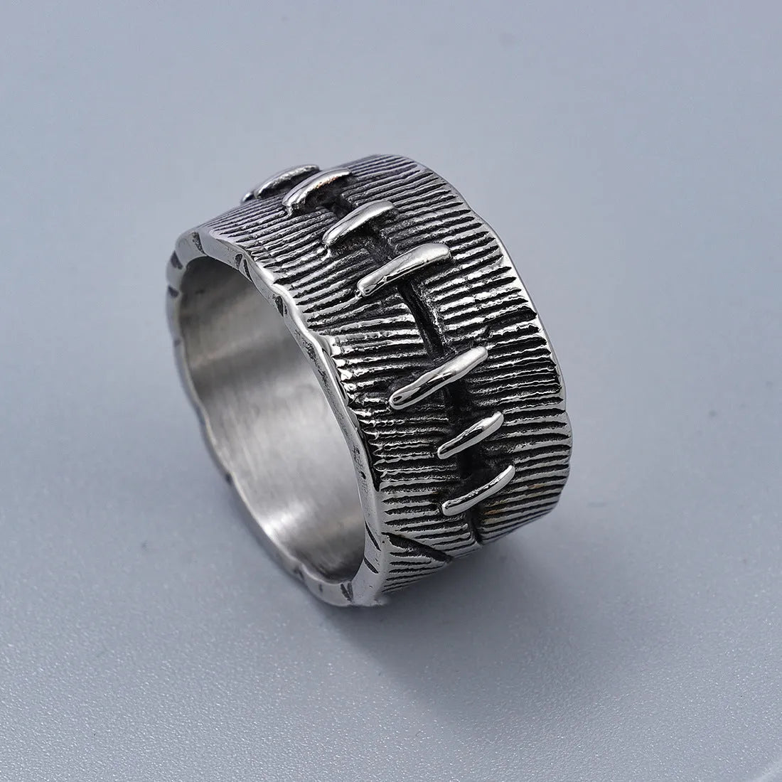 Titanium steel dark punk stitched ring with geometric U-shape design and double ring element in retro colour