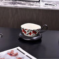 Antique style ceramic coffee cup and saucer set with 210ml capacity in black or orange retro design.