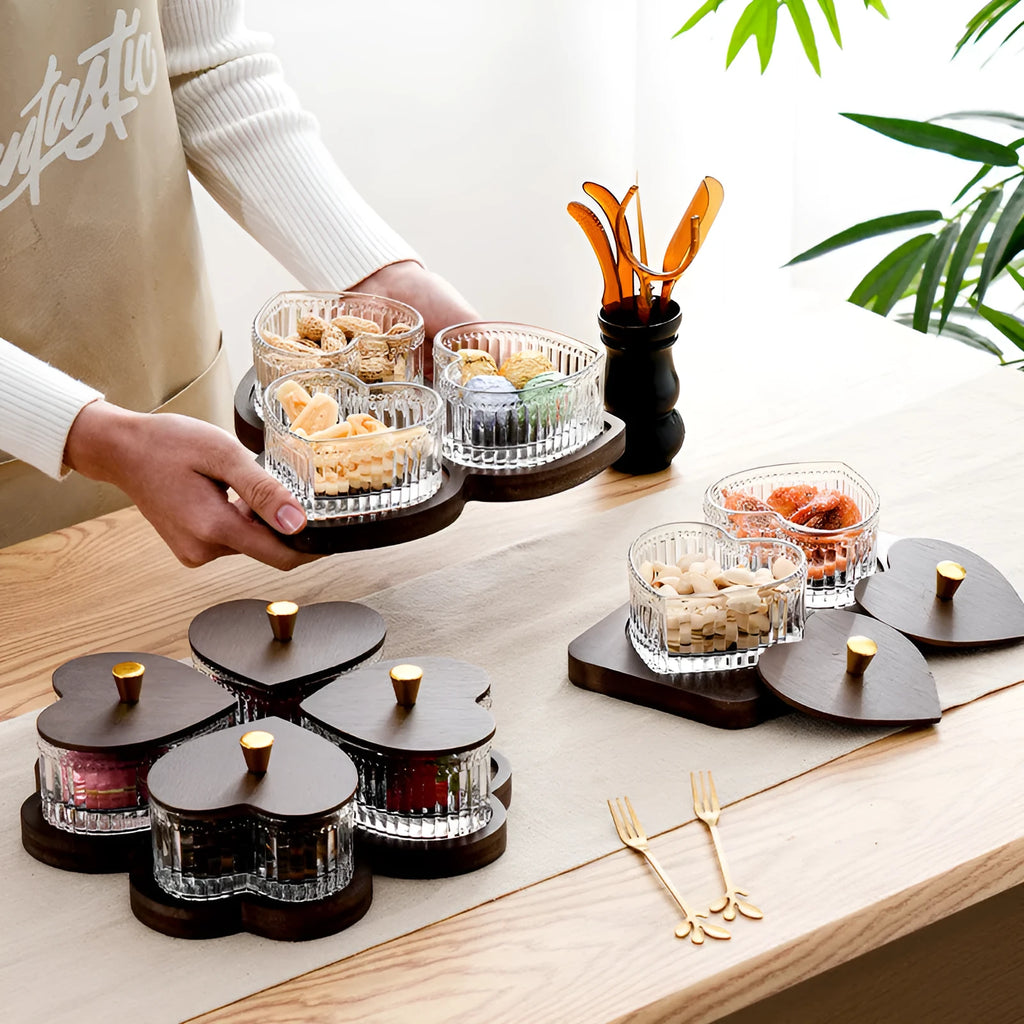 Glass retro-style serving platter with heart-shaped transparent lid and multiple food compartments.