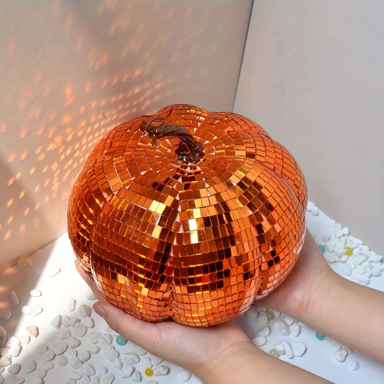 Handcrafted glass pumpkin ornament with embossed detail for Halloween and Christmas decoration.