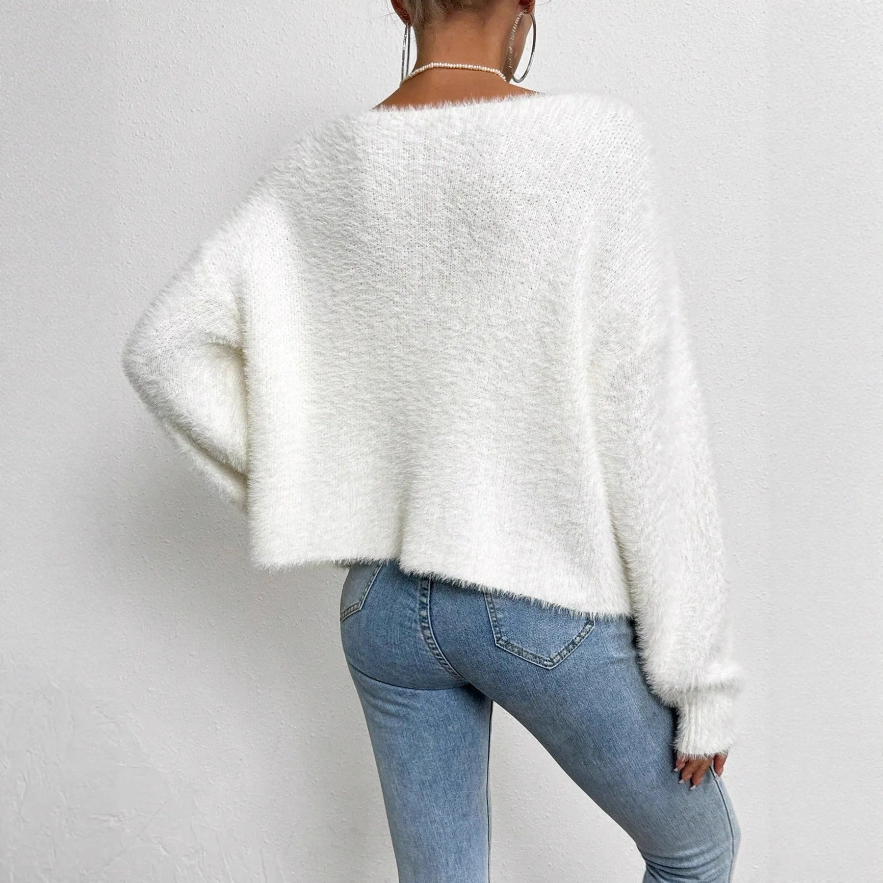 Women's white V-neck cardigan with bead detailing on polyester knit fabric