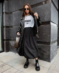 Women's cotton long skirt in solid black colour with elastic waistband and long length design