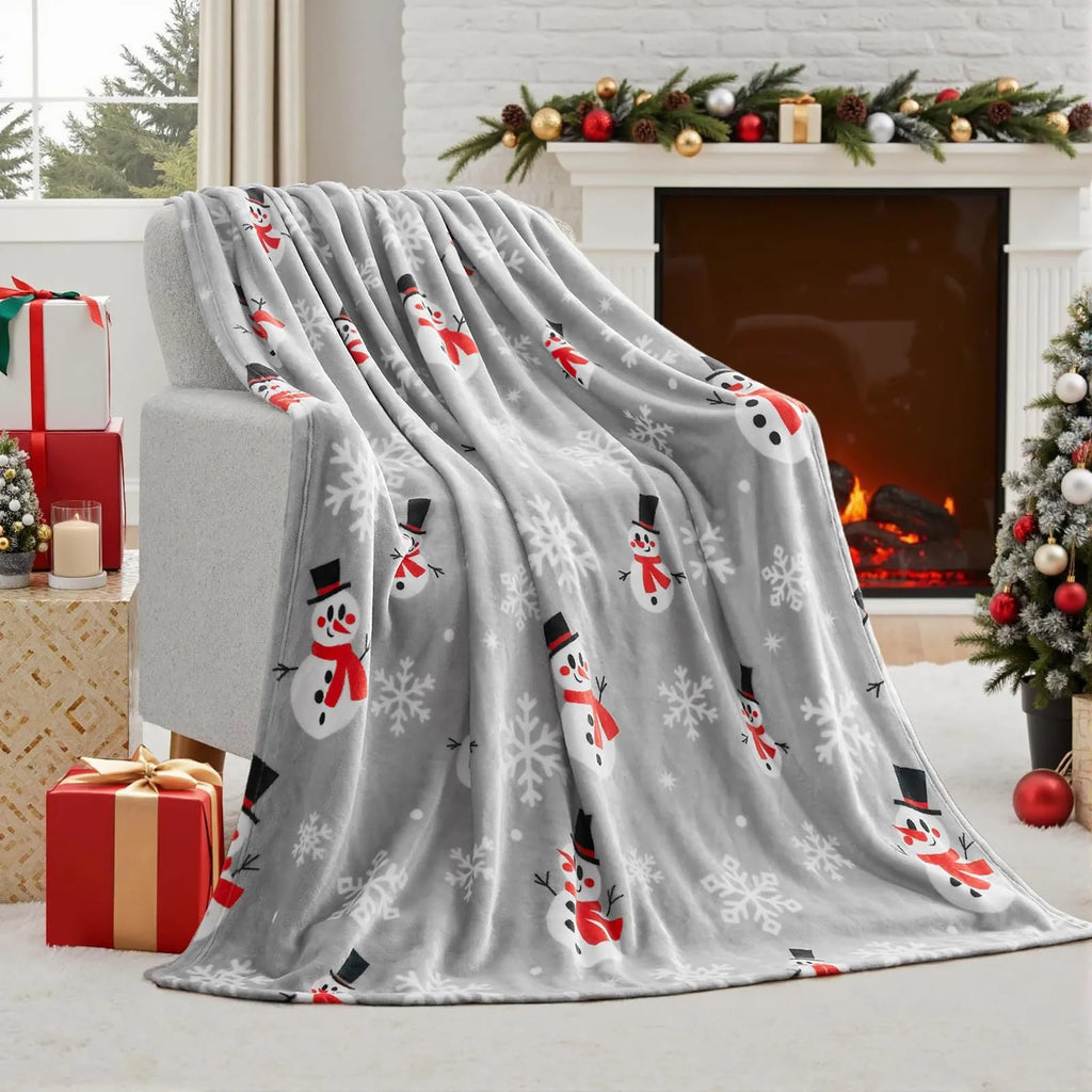 Soft flannel red Christmas blanket with plush texture on a sofa, showing reversible design and size scale.