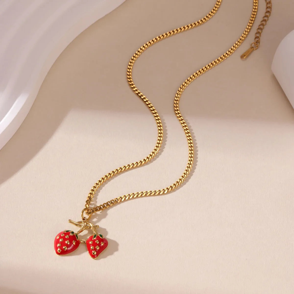 Women's stainless steel strawberry fruit pendant necklace in red and white gradient colours