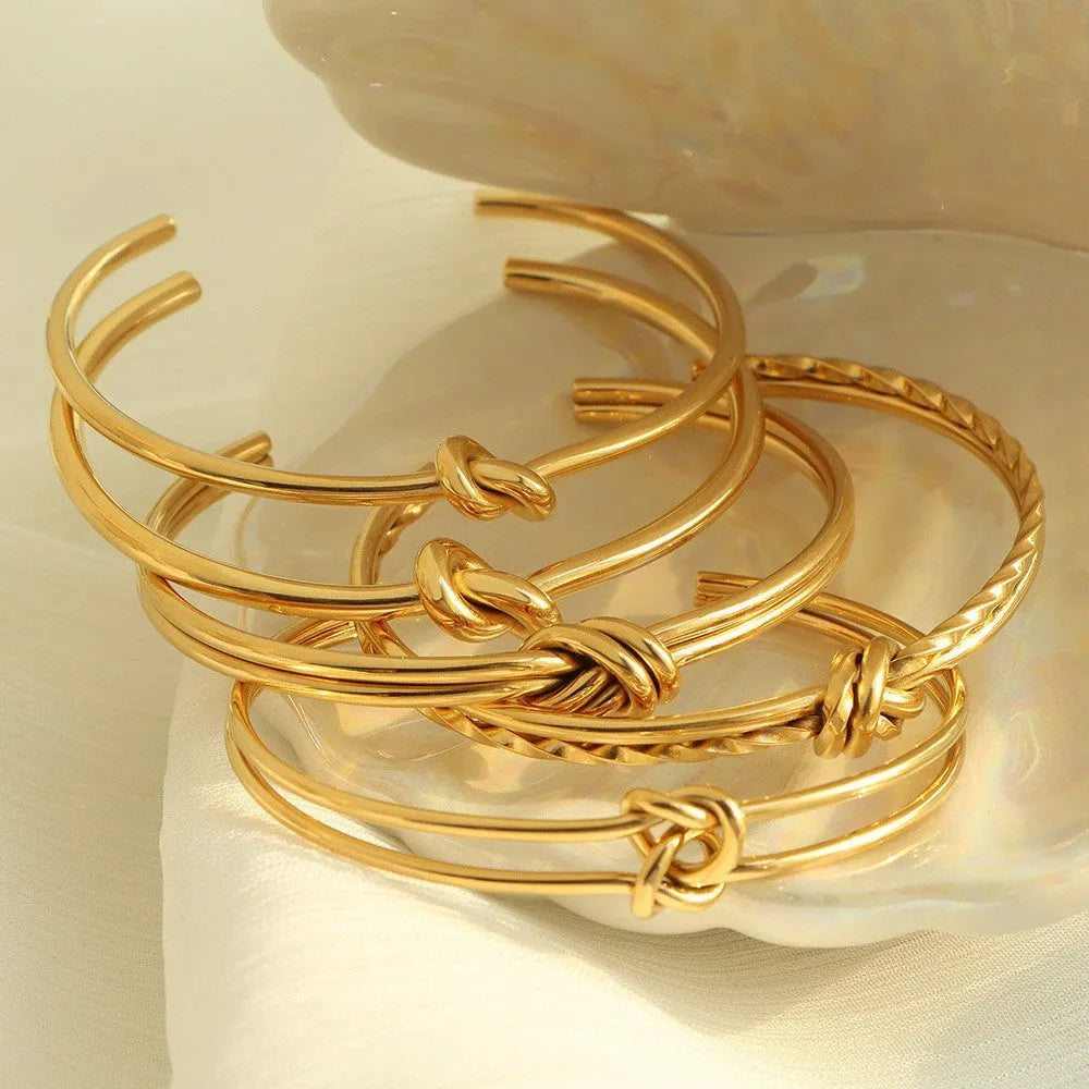 Adjustable knotted C-shaped double-layer bracelet in stainless steel with gold plating