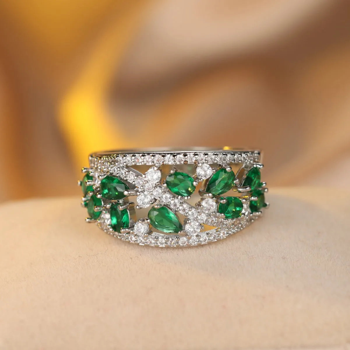 Women's hollow fashion ring in copper with stone accents, shown in gold and platinum colour options.