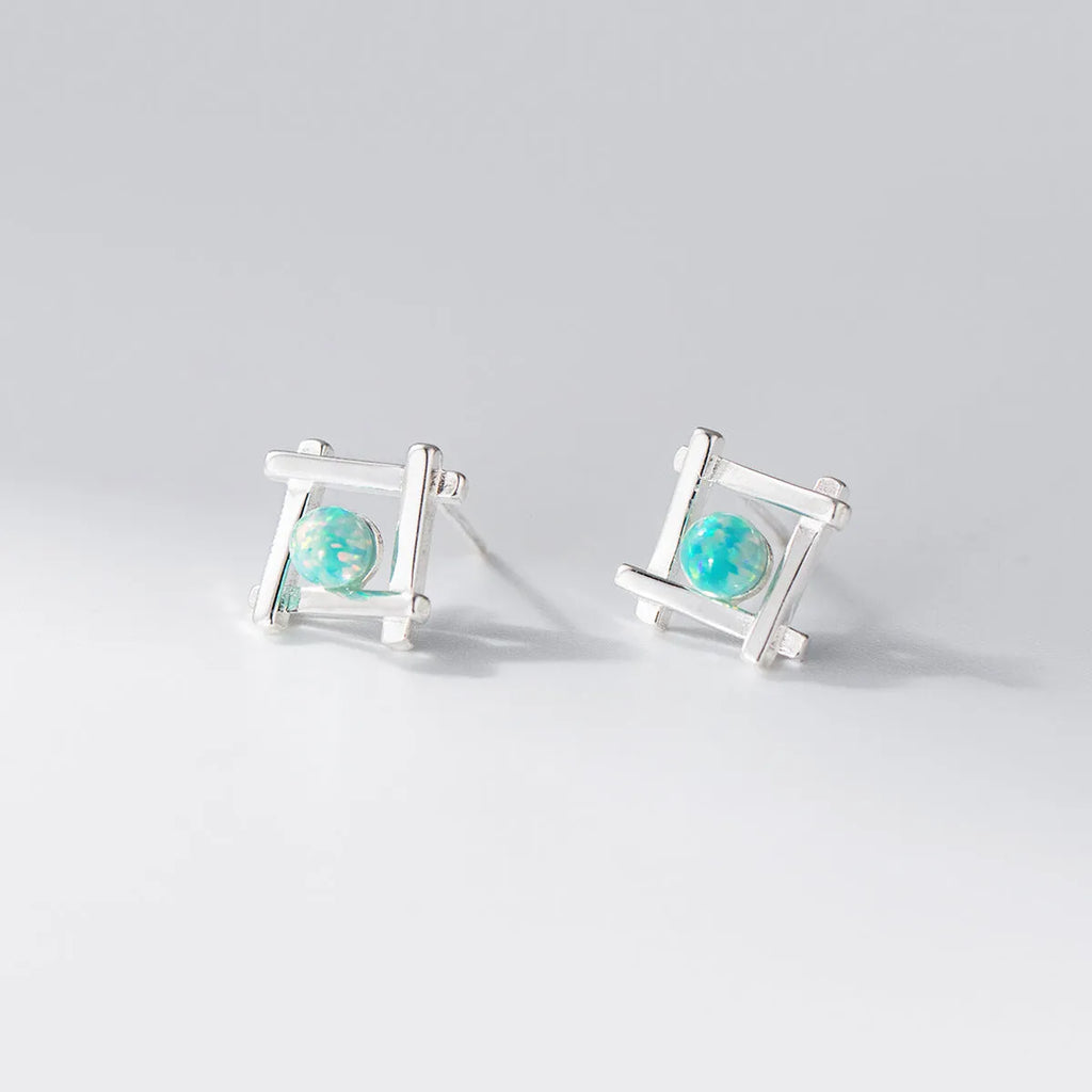 Geometric cross quadrangle stud earrings in sterling silver with gold or silver finish options
