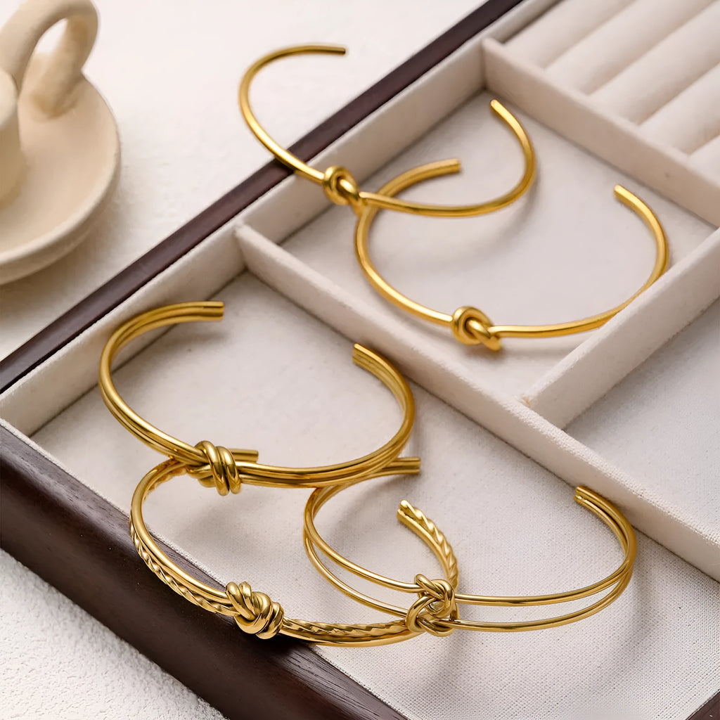 Adjustable knotted C-shaped double-layer bracelet in stainless steel with gold plating