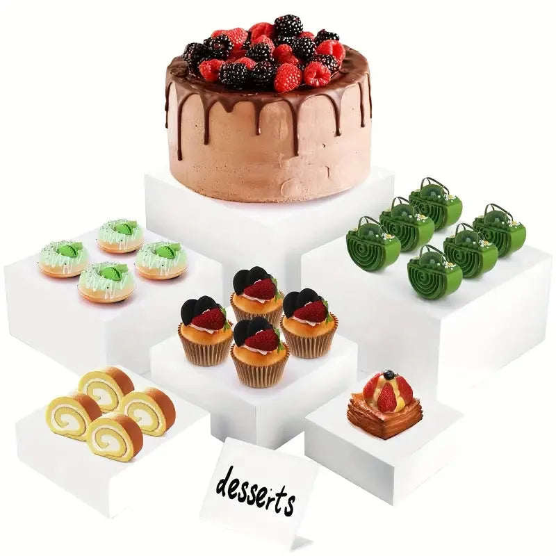 White plastic Suit Cube dessert display stand with six modular pieces arranged in multi-level configuration