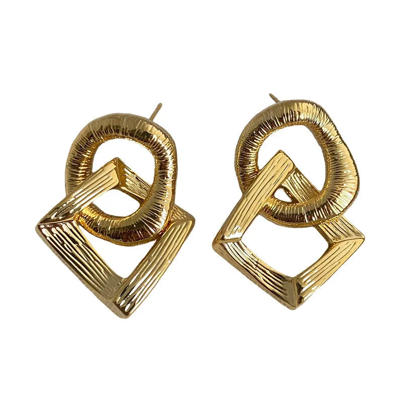 Geometric circle pendant earrings with 3.4cm drop in gold or silver electroplated finish