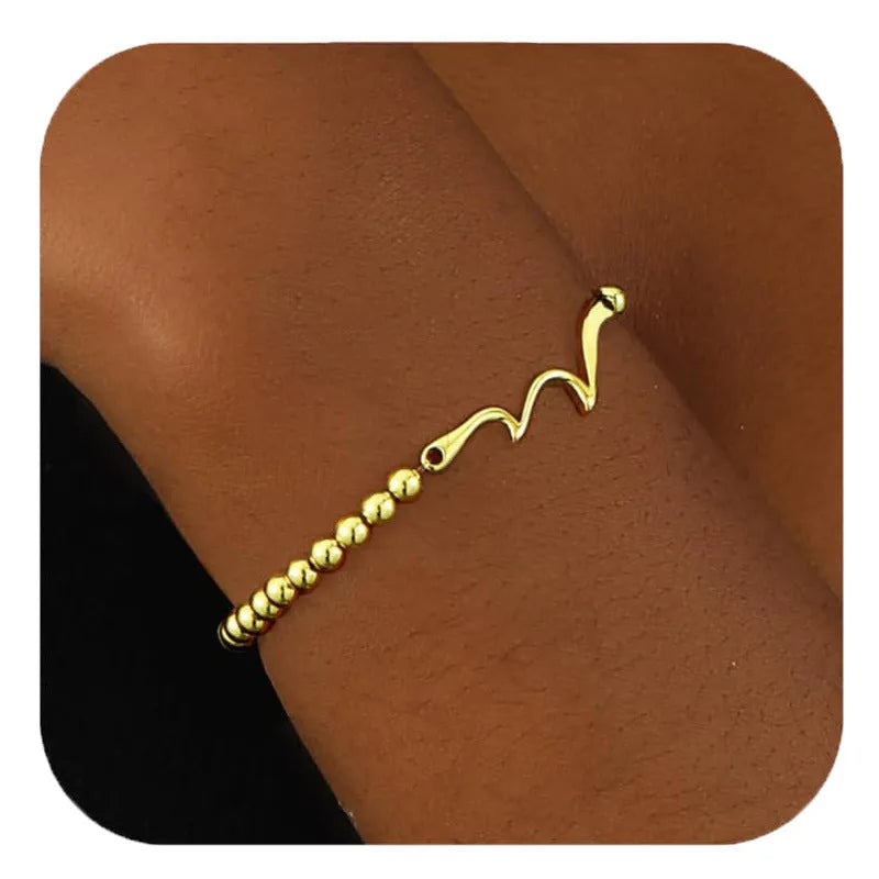 Adjustable stainless steel beaded bracelet for women in a simple geometric style with round beads.