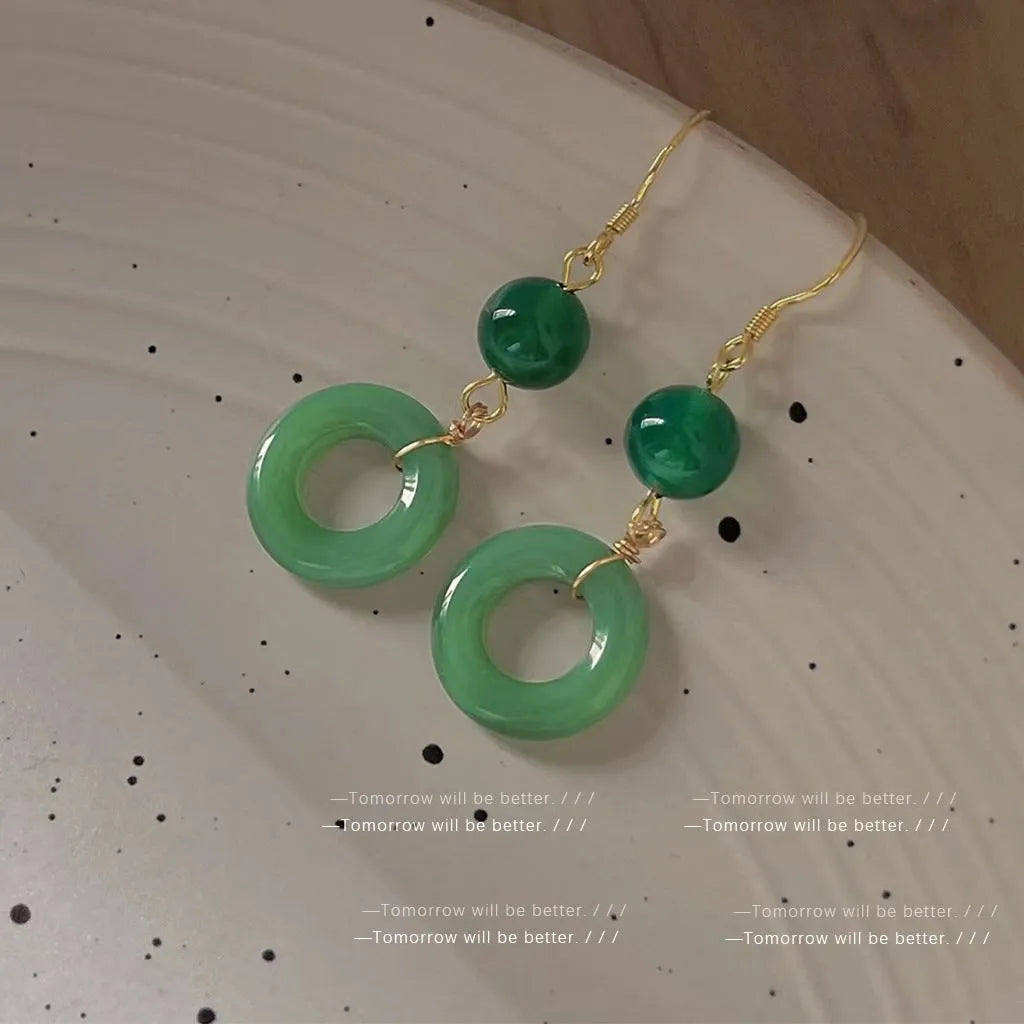 Green jade design peace buckle earrings with 14K gold plating and geometric ring details for Hanfu style