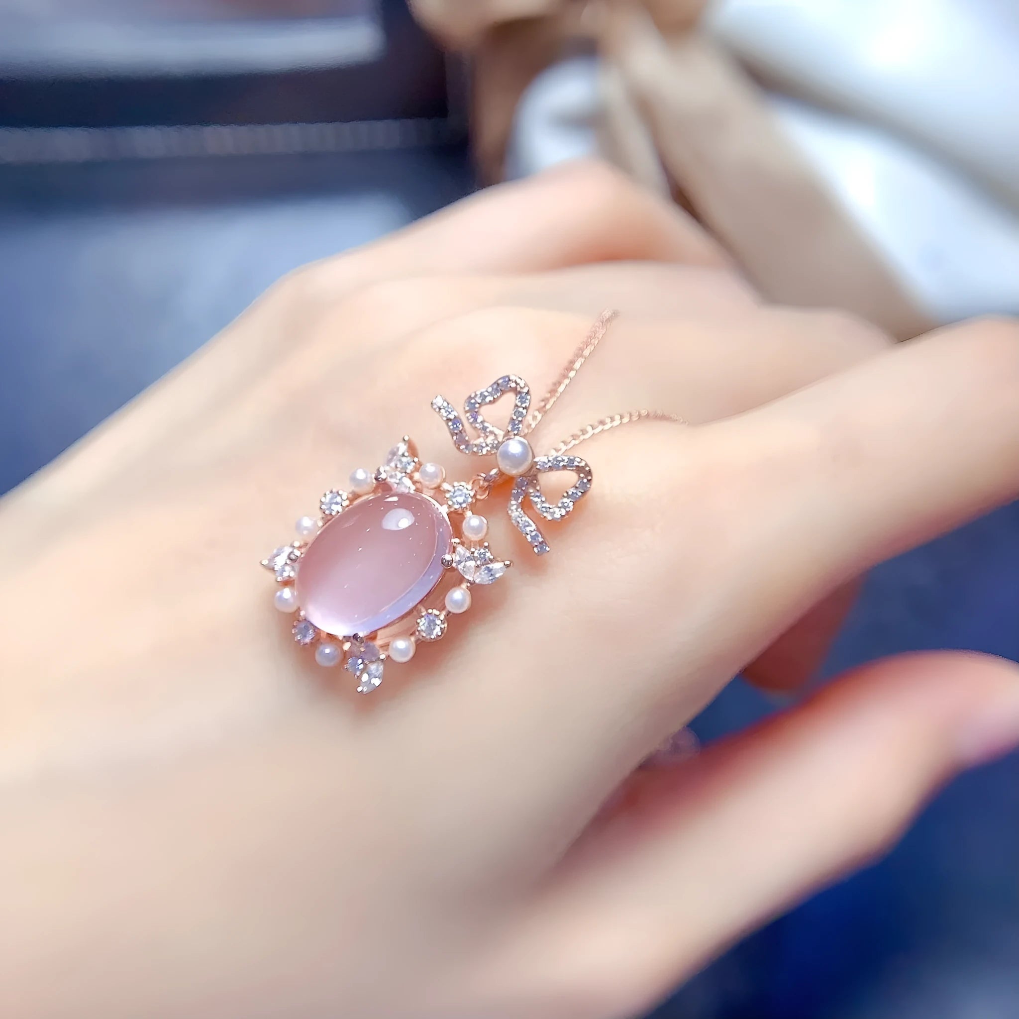 Geometric rose quartz pendant necklace with rose gold plated silver mounting on alloy chain