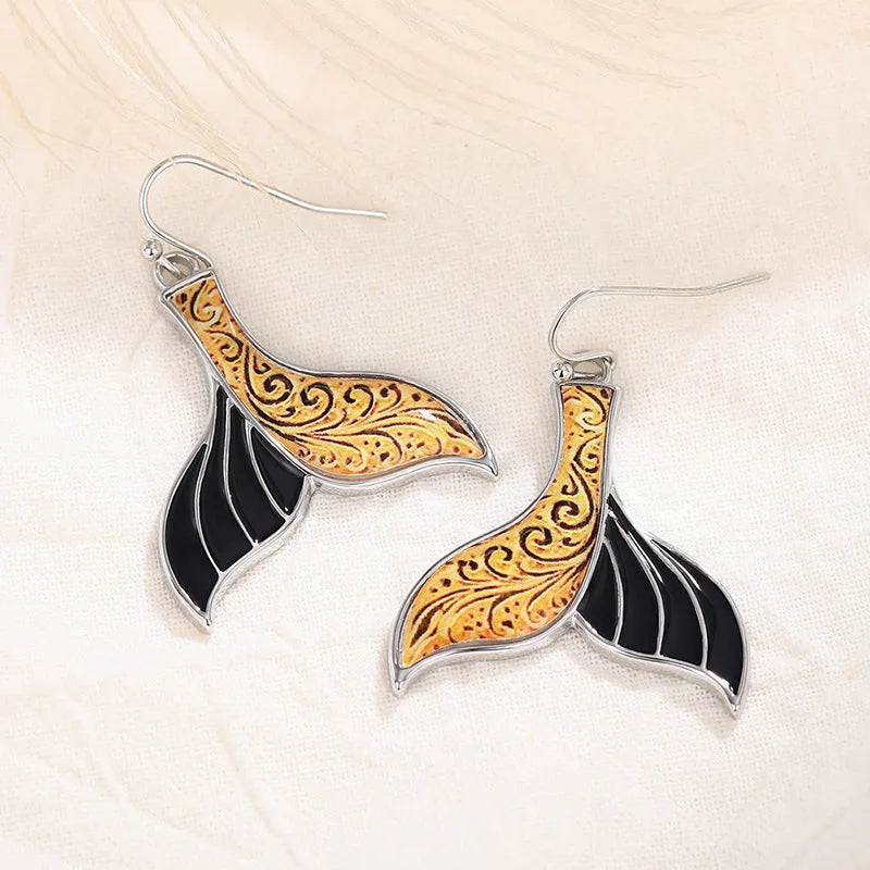 Women's retro whale fishtail alloy earrings in white gold colour, approximately 3cm length