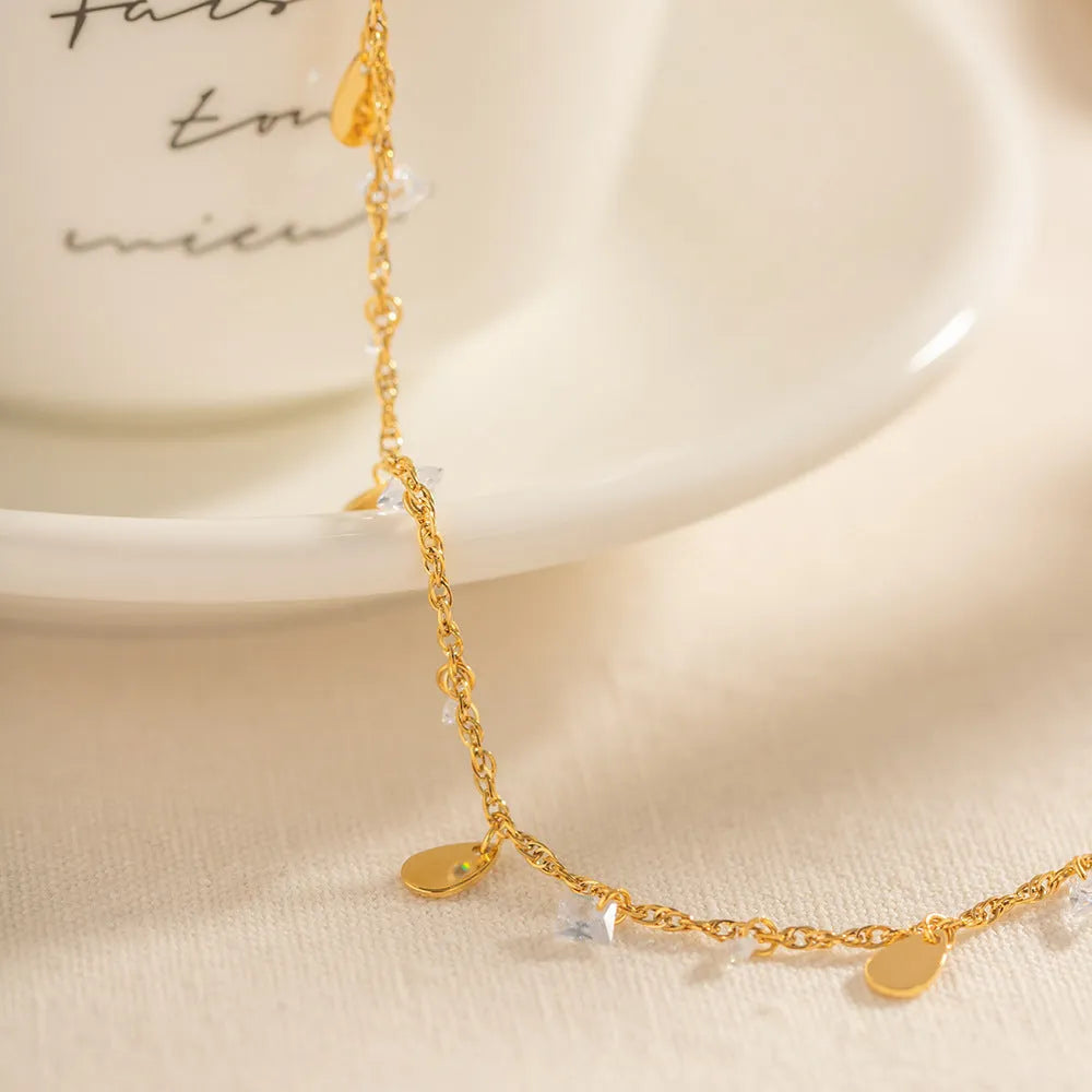Women's stainless steel anklet with geometric water drop tassel design on adjustable chain