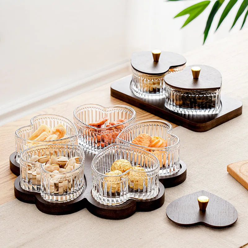 Glass retro-style serving platter with heart-shaped transparent lid and multiple food compartments.