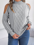 A woman's strapless, twisted-knit sweater with long lantern sleeves and a half-high collar.