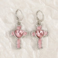 Women's alloy earrings with cross, heart, animal, and zodiac designs in white, black cat, and antique silver finishes