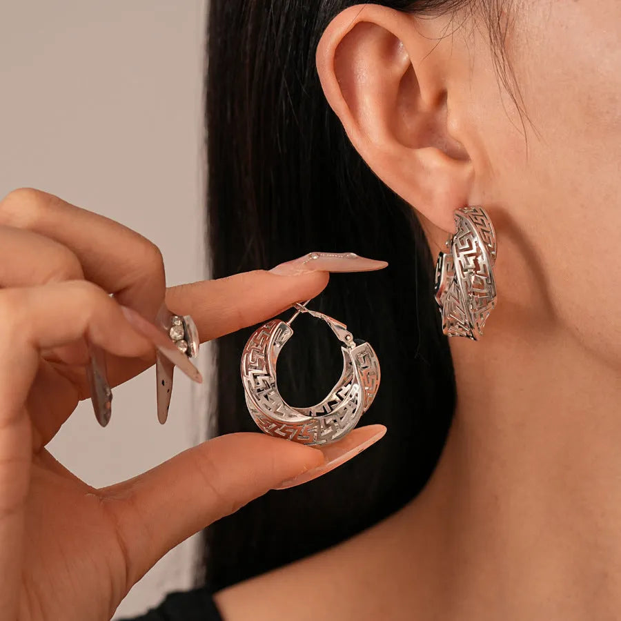 Geometric hollow stud earrings with twisted round design in gold electroplated finish