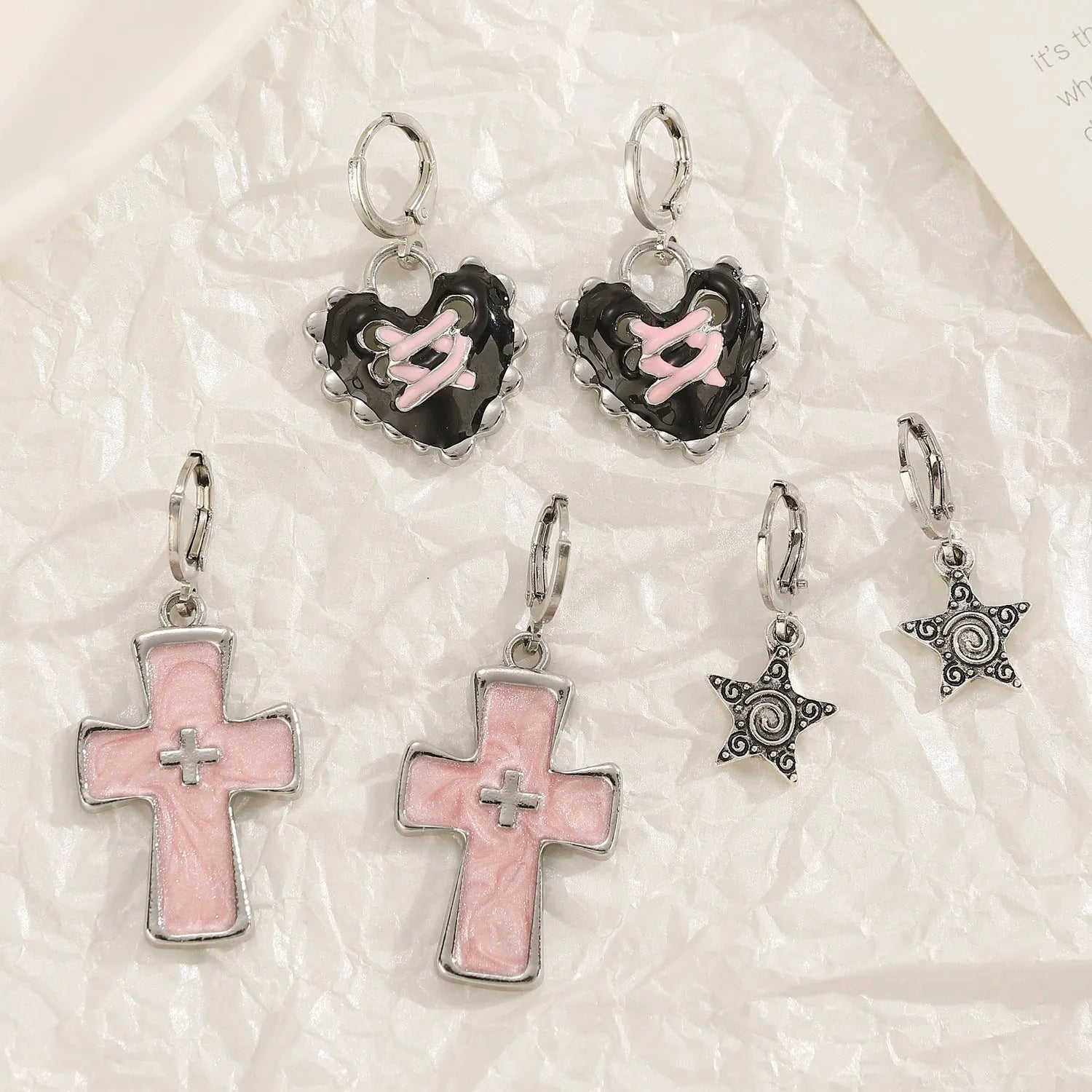 Women's alloy earrings with cross, heart, animal, and zodiac designs in white, black cat, and antique silver finishes