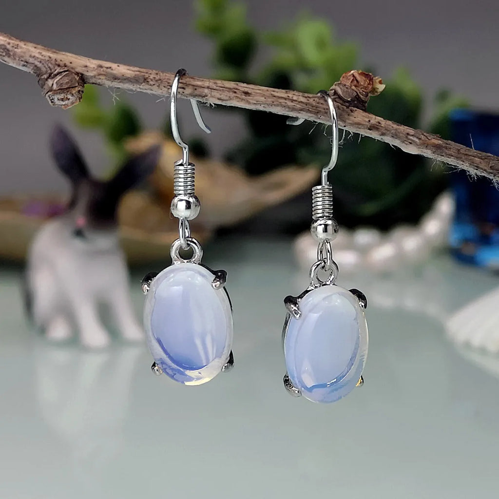 Moonlight white opal drop earrings with retro moonstone design and cross motif on alloy