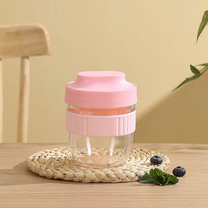 Green, purple, white, and pink plastic salad cups with lids and spoons in small and large sizes.