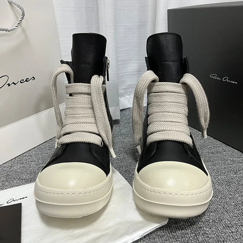 Black genuine leather high-top sneakers with a side zipper and round toe on a rubber platform sole.