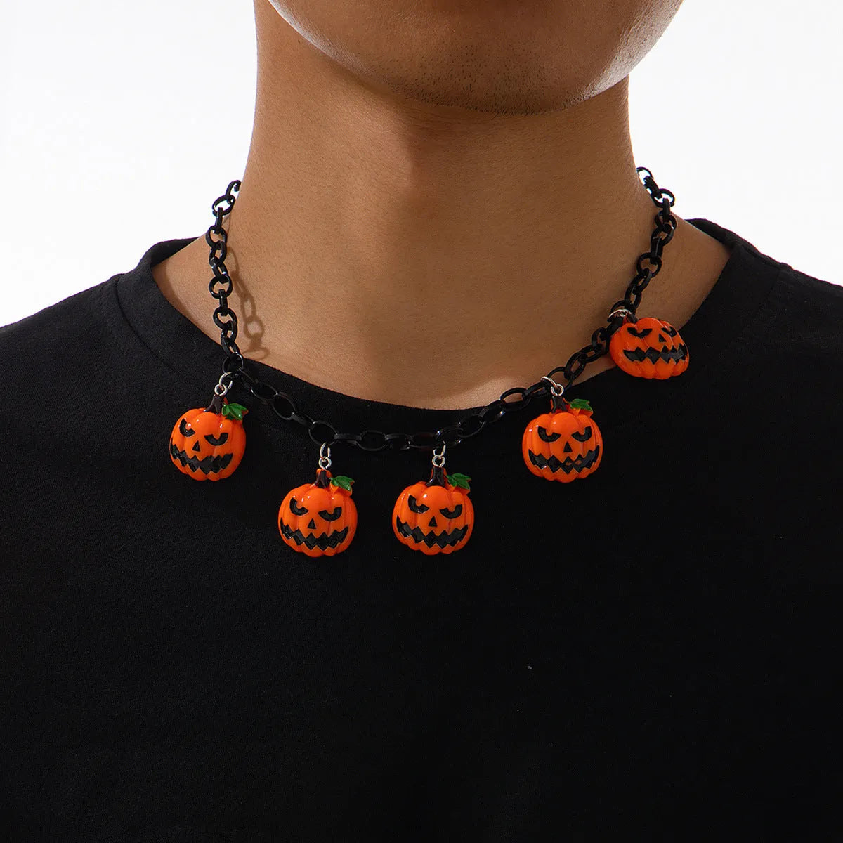 Cartoon pumpkin Halloween necklace with mixed colour acrylic pendant on a regular chain.