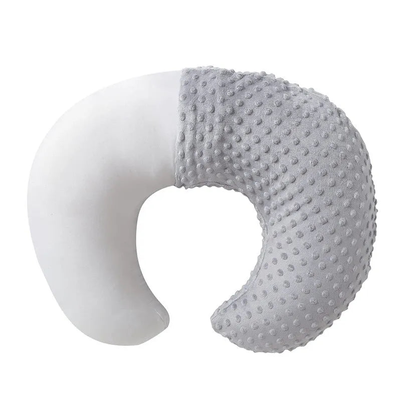 Pink nursing pillow with removable cover for breastfeeding and bottle feeding support.