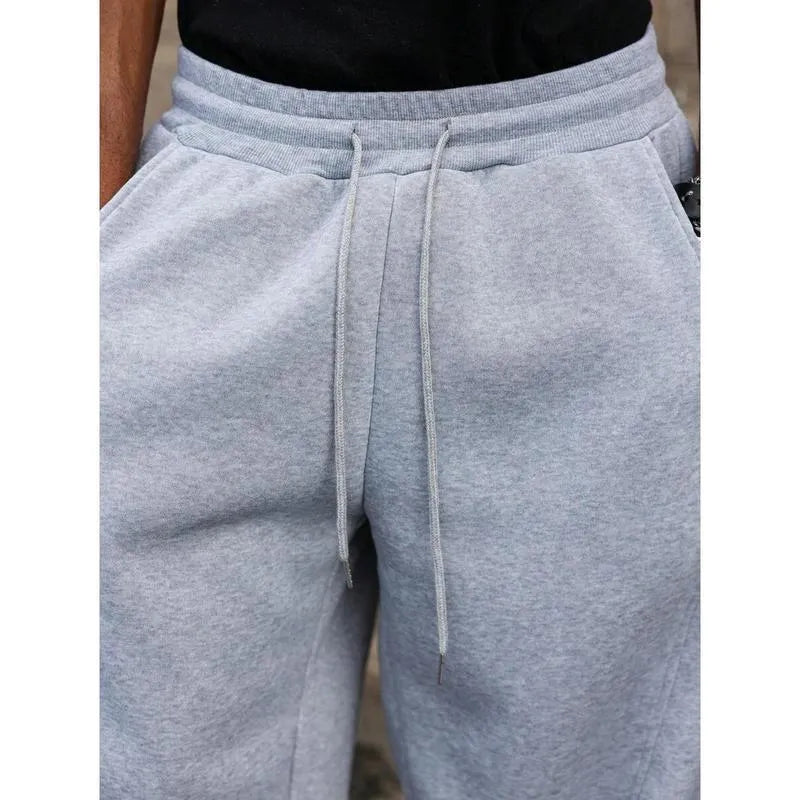 Men's straight high waist casual pants in bamboo fibre blend fabric showing elastic fit and cropped length