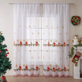 Pair of American Christmas curtains with white embroidered snowflake design on red polyester fabric, hung on a window.